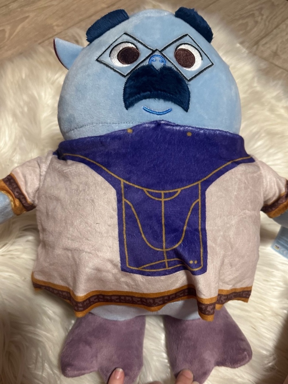 Blue Plush Stuffed Character Toy with Purple Outfit